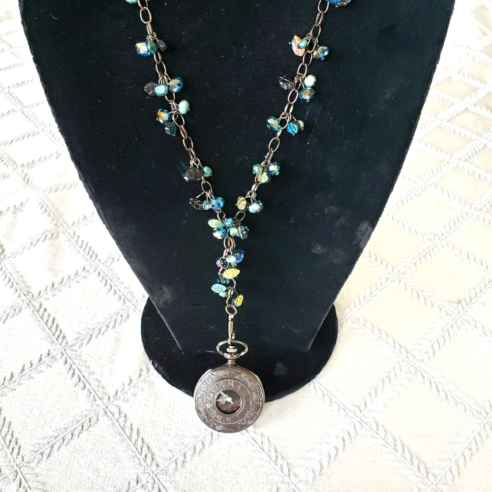 Necklace with watch.